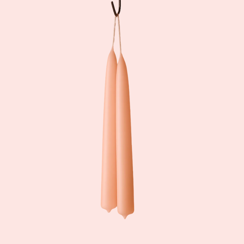 Load image into Gallery viewer, Three peach-colored candles hanging against a light pink background