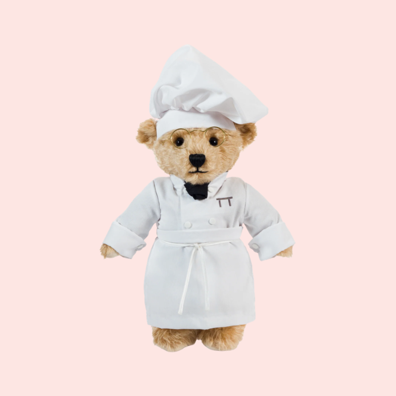 Load image into Gallery viewer, Teddy bear wearing a chef's outfit on a pink background