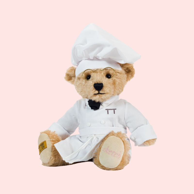 Load image into Gallery viewer, Teddy bear dressed as a chef on a pink background